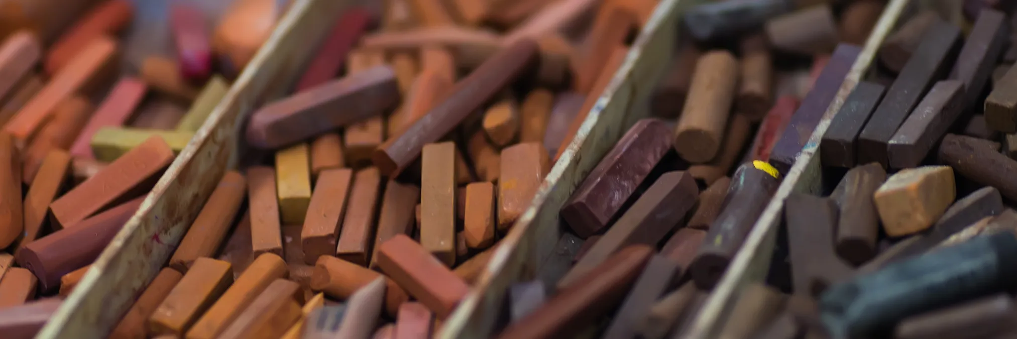 Sanguine drawing of three quarters view of two figures on tan toned paper. One figure is facing forwards, and the other one is facing backwards.